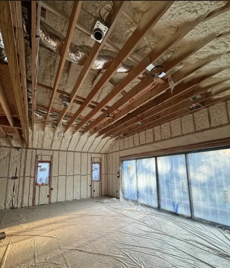 Interior walls and ceiling insulated with spray foam during new construction in Denton